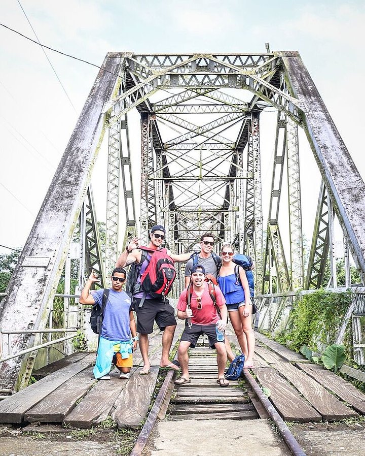 group of people taking a photo on an old bridge panama costa rica border crossing panama travel